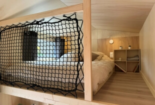 Chambre de la tiny house l'escapade